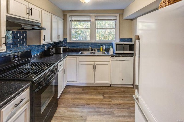 kitchen featuring light hardwood / wood-style floors, white cabinetry, sink, and white appliances