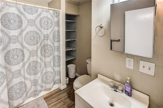 bathroom featuring vanity, toilet, hardwood / wood-style flooring, and curtained shower