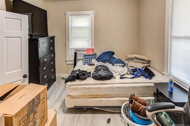 bedroom with light hardwood / wood-style flooring