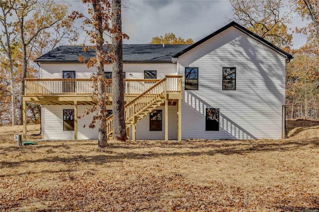 back of house featuring a wooden deck