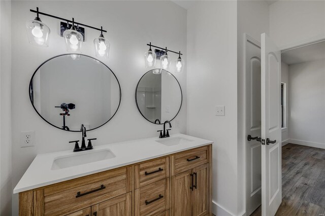 bathroom featuring hardwood / wood-style floors and vanity