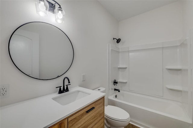 full bathroom featuring toilet, washtub / shower combination, and vanity