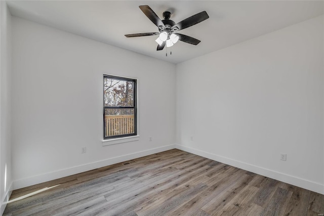 unfurnished room with ceiling fan and light hardwood / wood-style floors