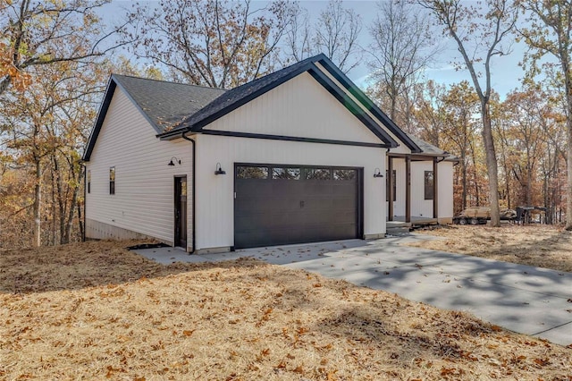 view of side of property featuring a garage