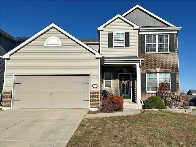 view of front of property with a front lawn and a garage