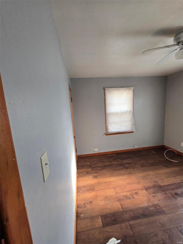 empty room featuring hardwood / wood-style flooring and ceiling fan