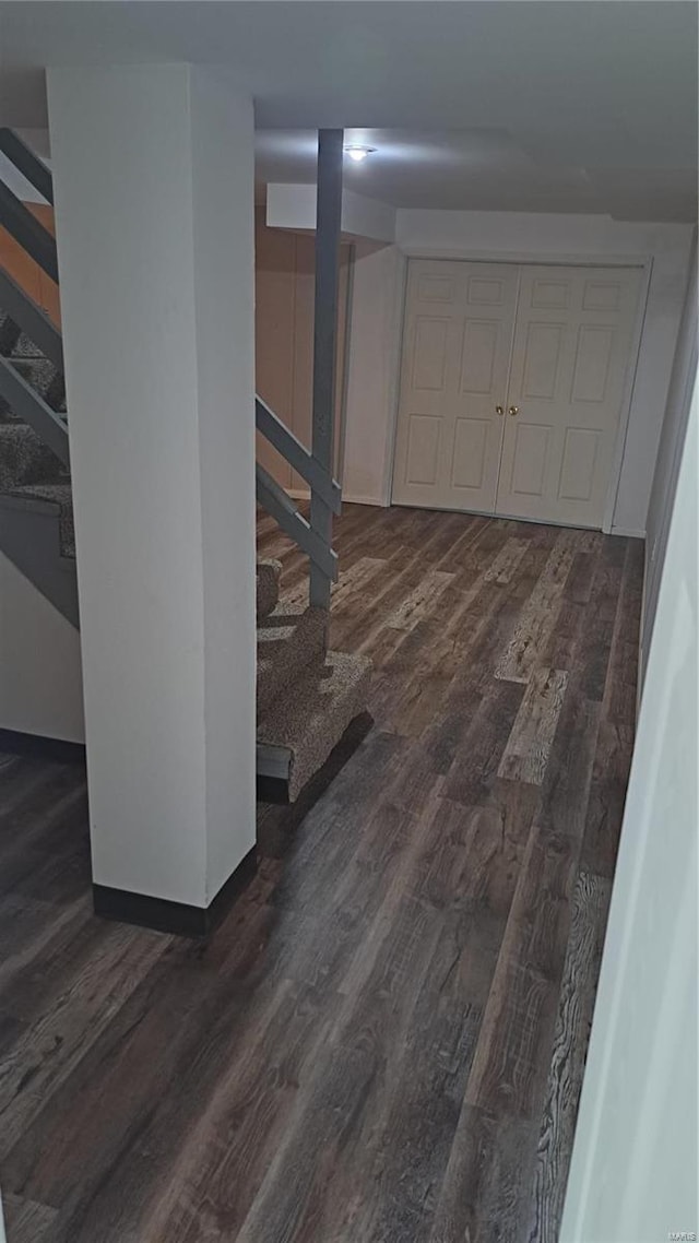 basement featuring dark wood-type flooring