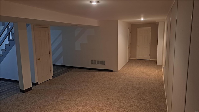 interior space featuring dark carpet