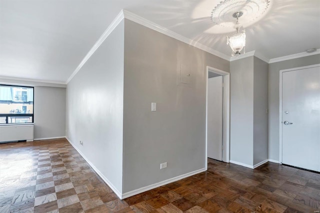 spare room with ornamental molding, a chandelier, and dark wood-type flooring