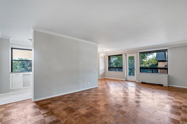 empty room with ornamental molding, parquet floors, and an inviting chandelier