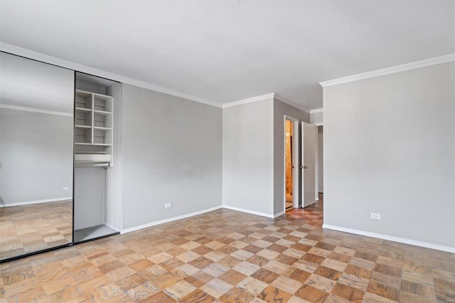 spare room featuring crown molding and light parquet flooring