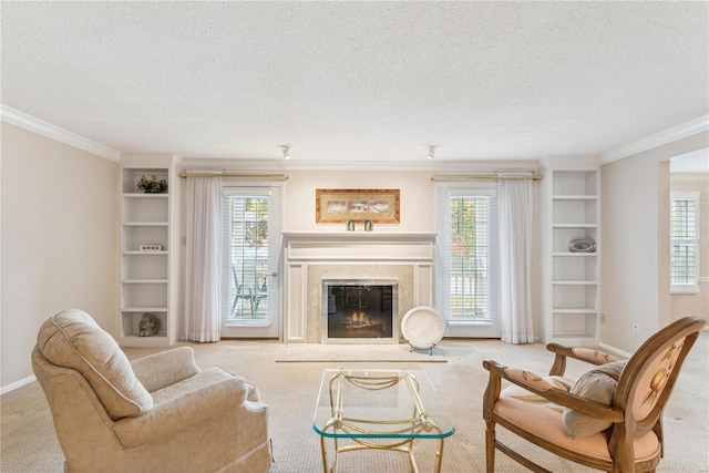 carpeted living room featuring ornamental molding, a textured ceiling, and a healthy amount of sunlight