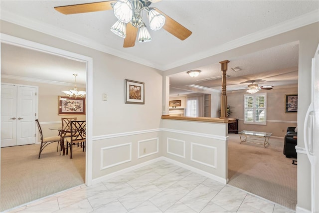 kitchen featuring light carpet, crown molding, a textured ceiling, and ceiling fan with notable chandelier