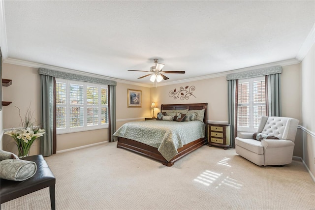 bedroom with crown molding, light colored carpet, and ceiling fan