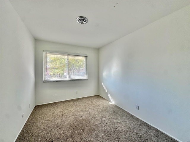 empty room featuring carpet flooring