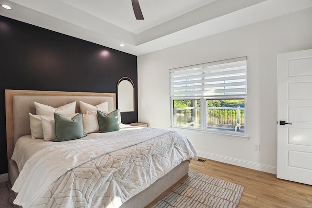 bedroom featuring light wood-type flooring and ceiling fan