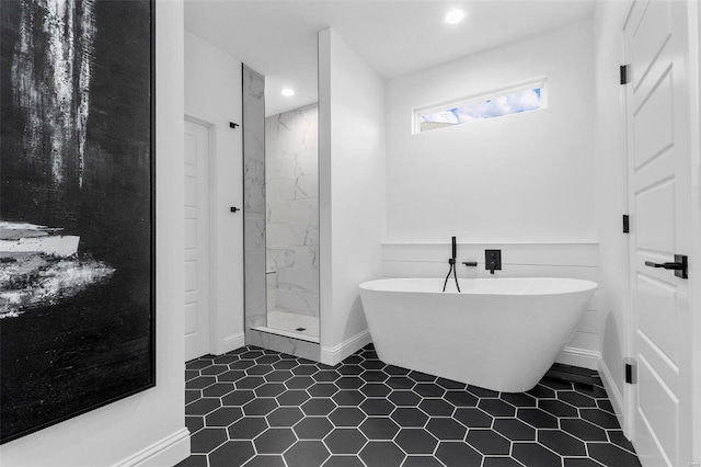 bathroom featuring tile patterned floors and independent shower and bath