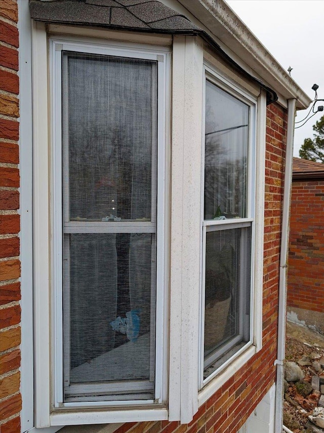 exterior details featuring brick siding