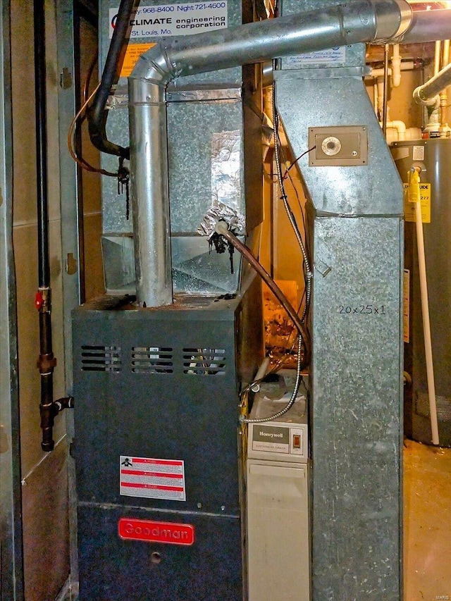 utility room featuring gas water heater