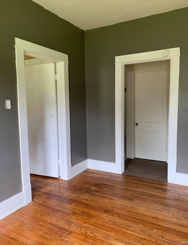 empty room with wood-type flooring