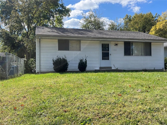 ranch-style home with a front lawn