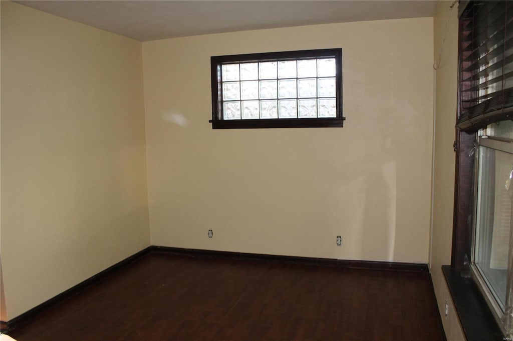 spare room with dark hardwood / wood-style floors