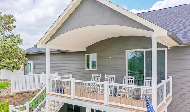 rear view of property featuring a deck