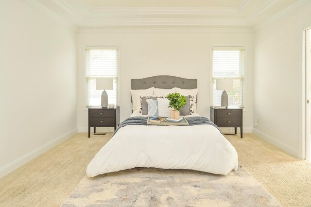 carpeted bedroom with crown molding and multiple windows