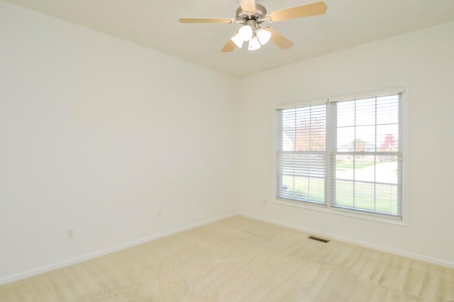 carpeted empty room with ceiling fan