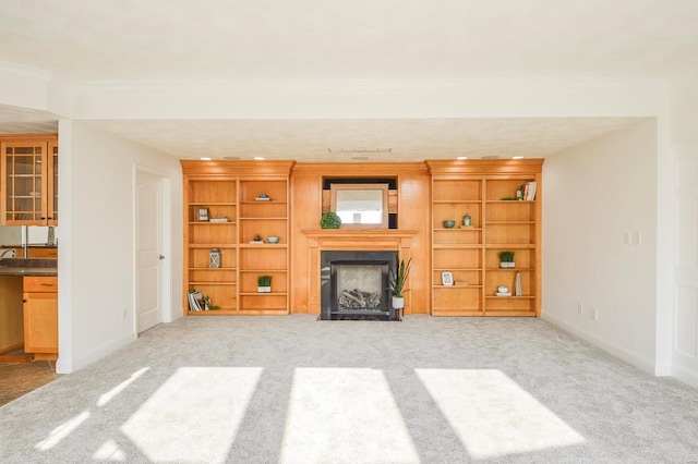 unfurnished living room featuring light carpet