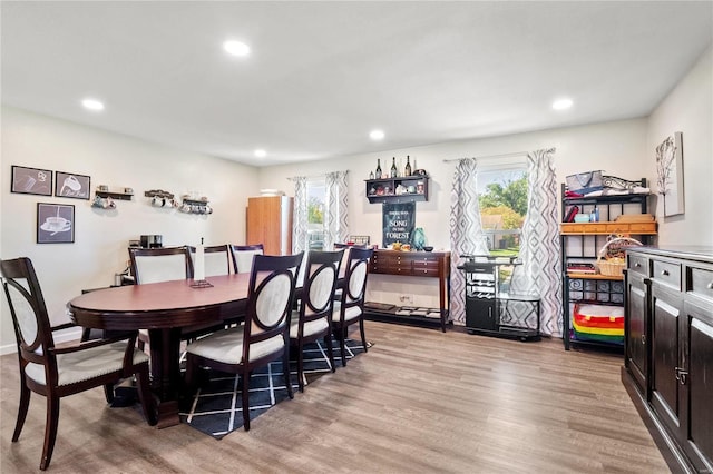 dining area featuring light hardwood / wood-style flooring and plenty of natural light