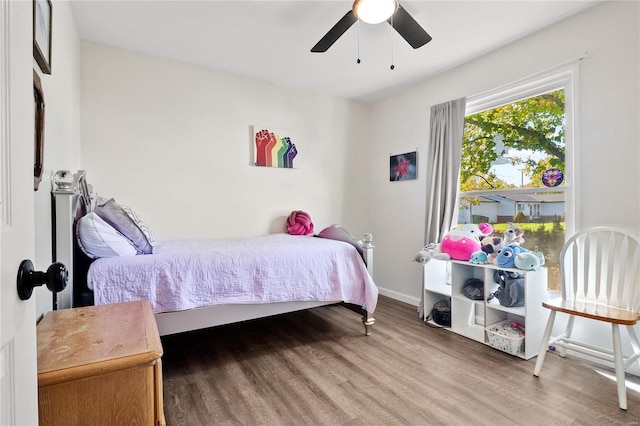 bedroom featuring wood-type flooring and ceiling fan