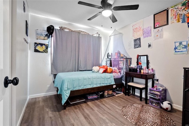 bedroom with hardwood / wood-style floors and ceiling fan