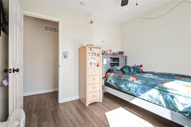 bedroom featuring wood-type flooring and ceiling fan