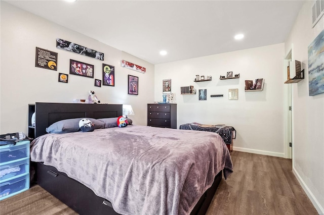 bedroom with hardwood / wood-style floors