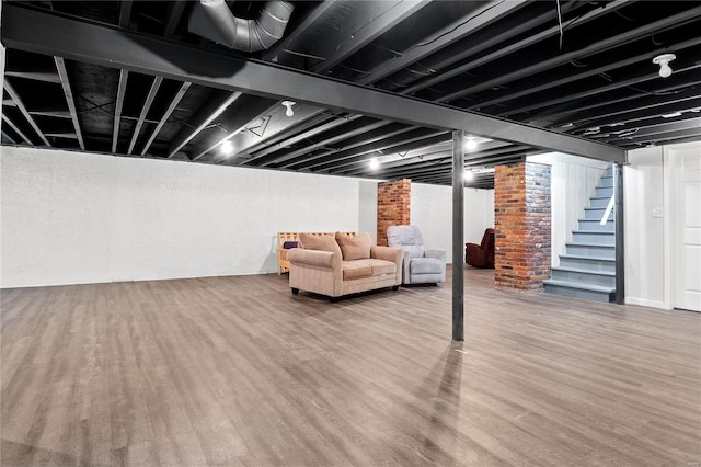 basement featuring hardwood / wood-style floors