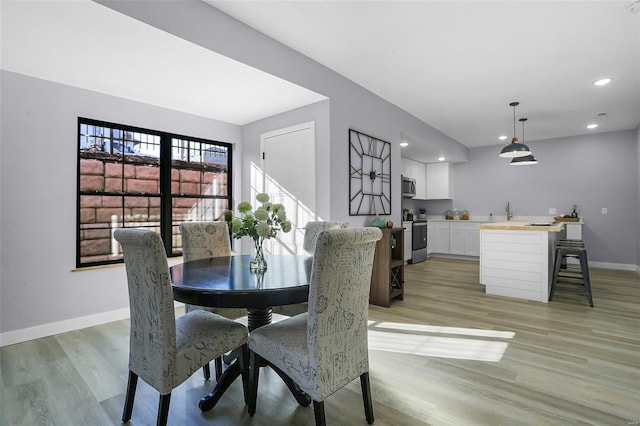 dining room featuring light wood-type flooring