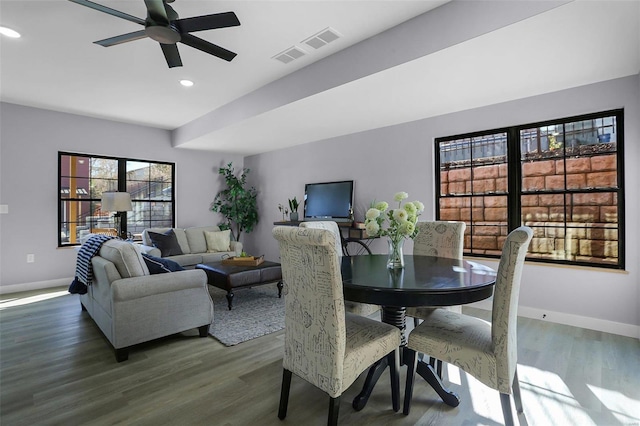 dining space featuring wood-type flooring and ceiling fan