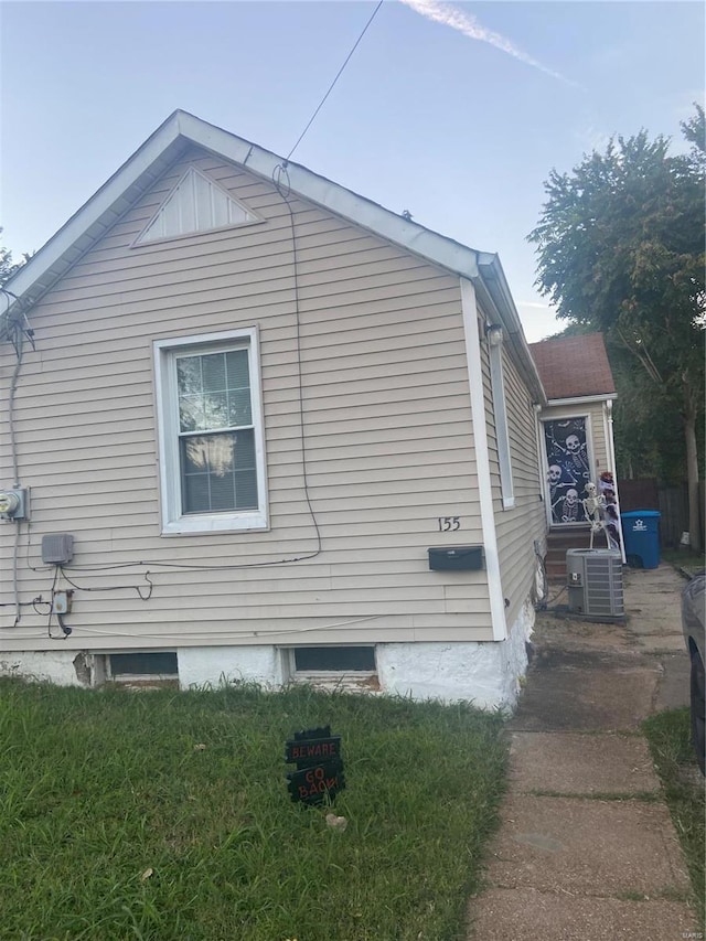 view of side of property featuring central AC unit