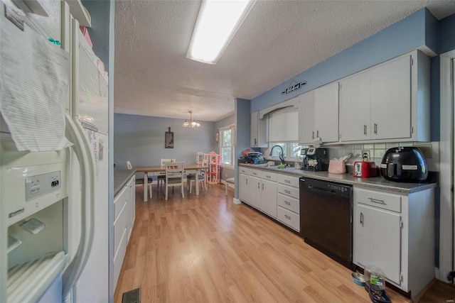 kitchen featuring white fridge with ice dispenser, dishwasher, light hardwood / wood-style floors, decorative light fixtures, and white cabinets