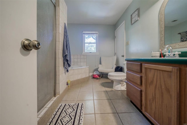 full bathroom with vanity, toilet, tile patterned floors, and independent shower and bath