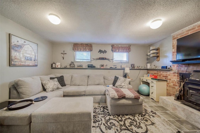 living room featuring a textured ceiling and a wood stove