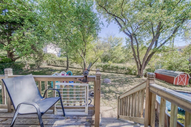 wooden deck with a storage shed