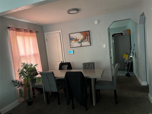 view of carpeted dining area