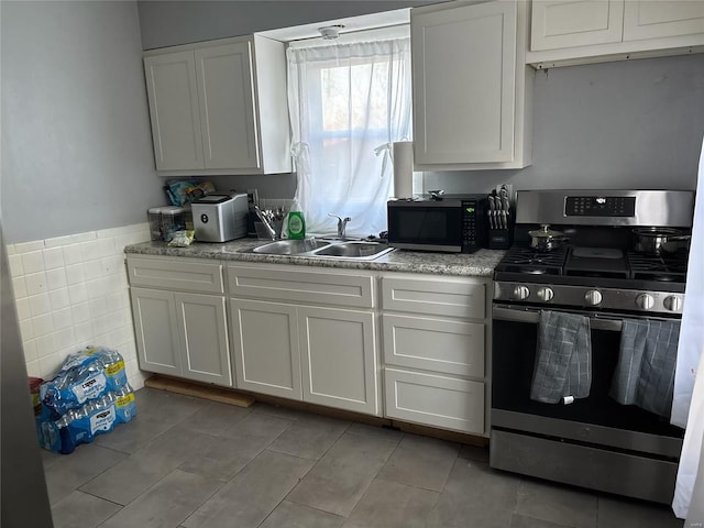 kitchen featuring sink, white cabinets, and stainless steel appliances