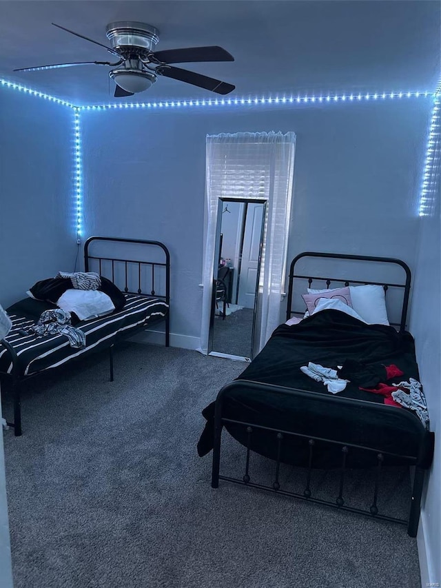 bedroom featuring ceiling fan and carpet floors