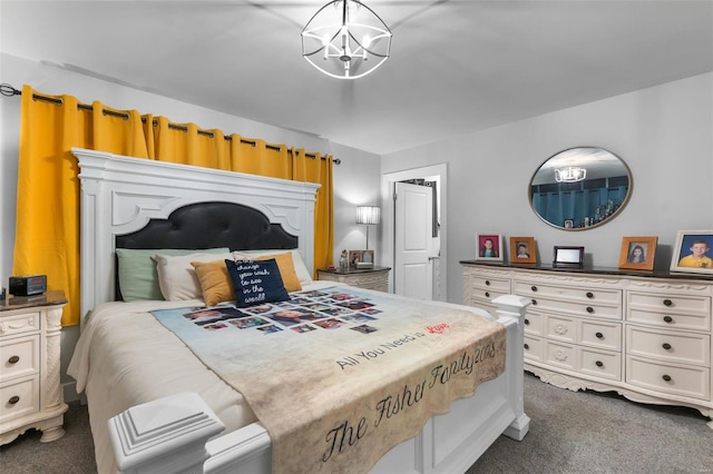 carpeted bedroom with a notable chandelier