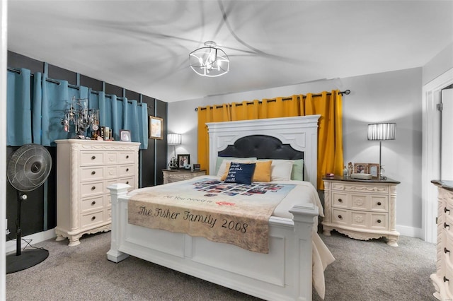 carpeted bedroom with a chandelier