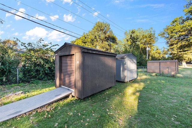 view of outdoor structure featuring a lawn