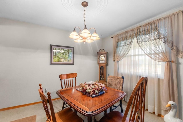 carpeted dining space featuring an inviting chandelier